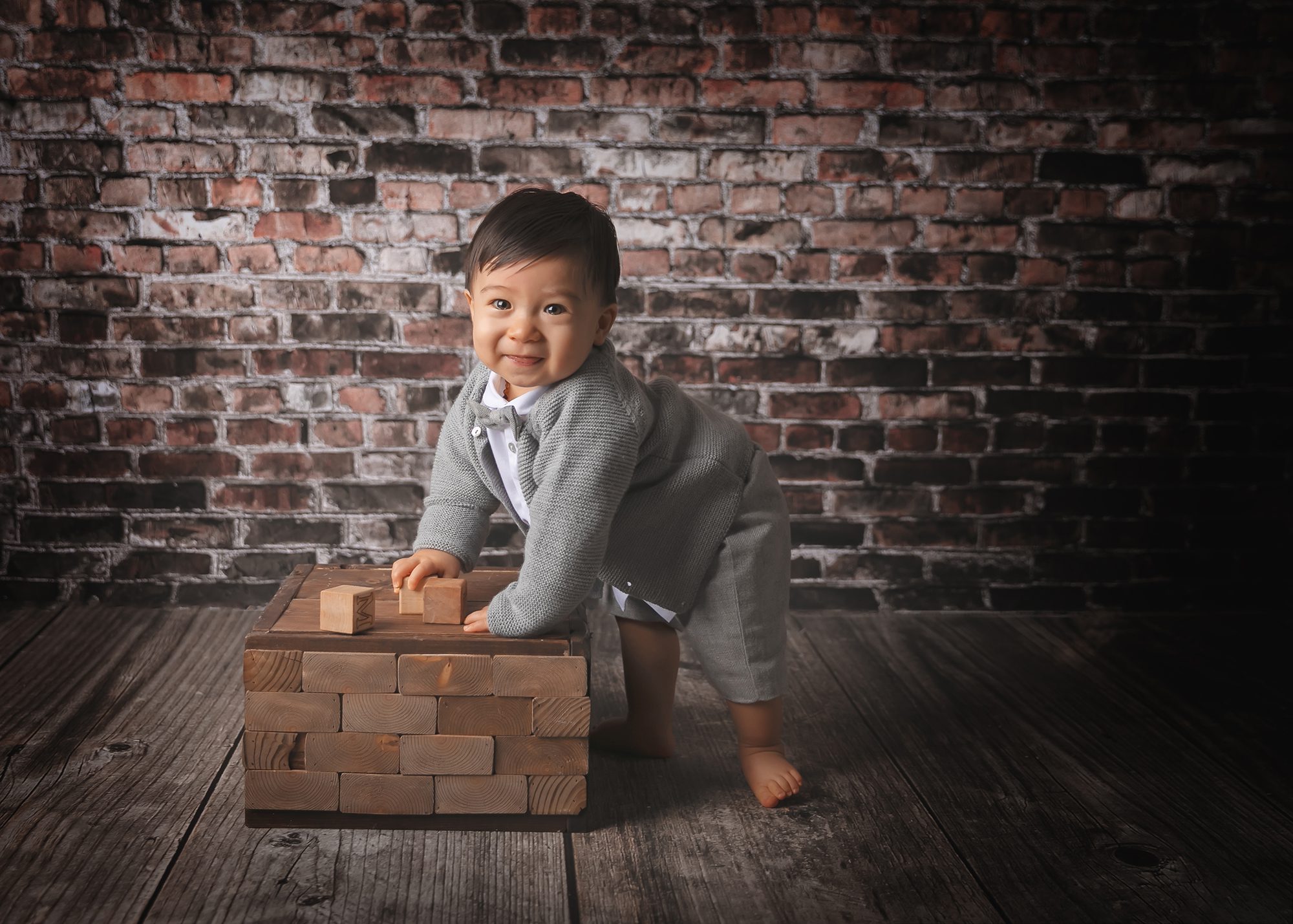 dc baby photography baby boy standing with box