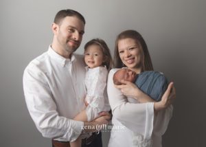 newborn baby with family