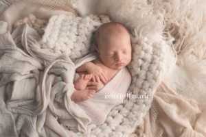 newborn boy on soft blankets