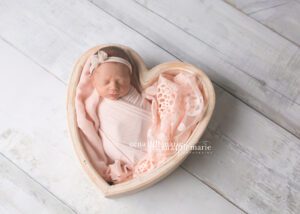 newborn babies - newborn girl in heart bowl